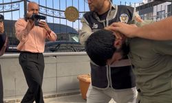 Eşini sokak ortasında darp etti